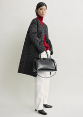 Quilted collarless coat black