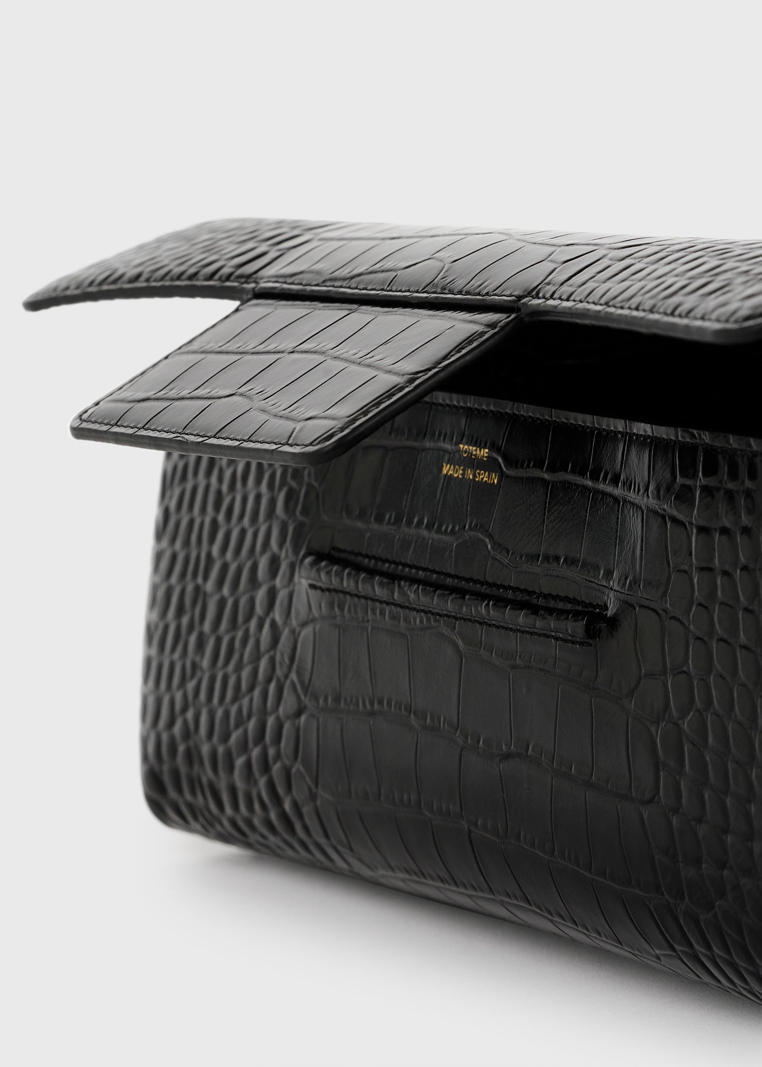 Soft croco-embossed t-clutch black
