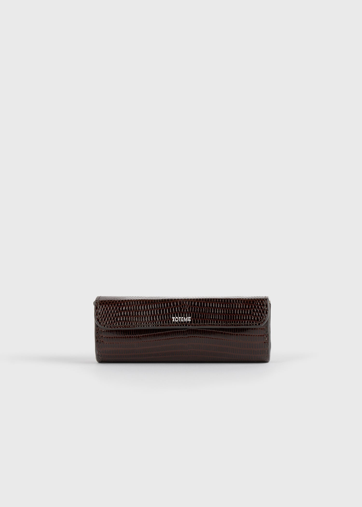 Lizard-embossed lipstick case brown